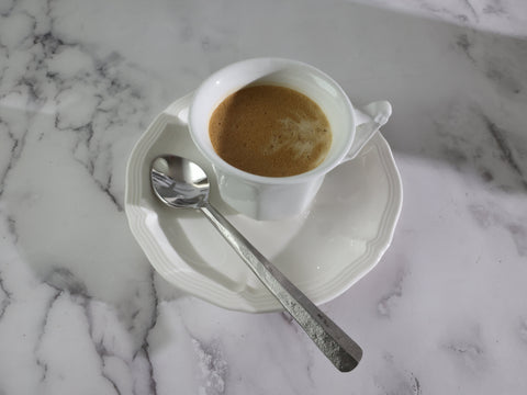 Coffee cup with a Ridge Demitasse Coffee Spoon