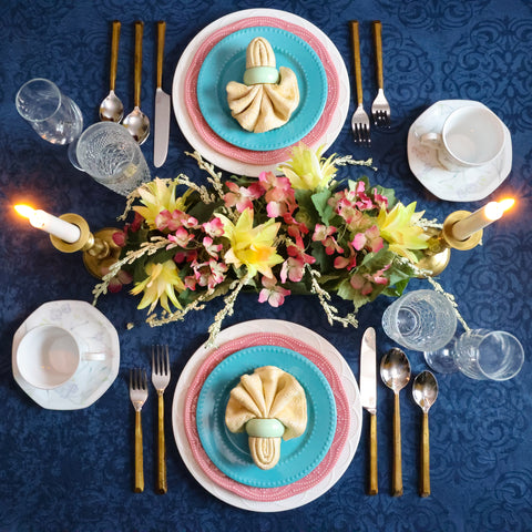 Plateau gold flatware and pastel plates are ideal for dinner table settings.