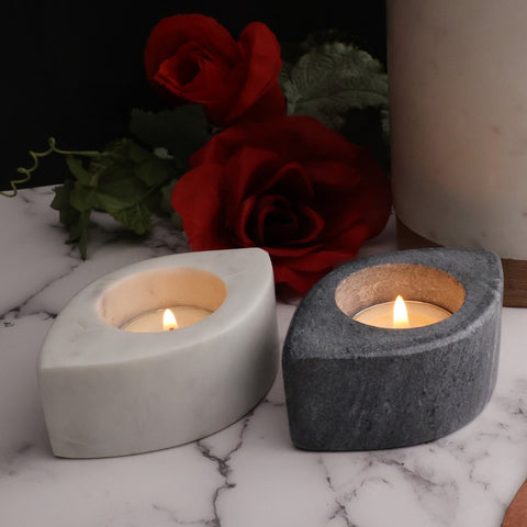 A pair of artisan crafted marble tea light holders- one black and one white 