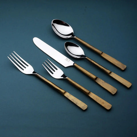 Celia flatware 5 Pc. Set in vintage gold with mirror-polished utensils. 